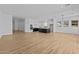 Expansive open-concept space seamlessly integrates living, dining, and kitchen areas, perfect for modern living and entertaining at 32535 N 135Th Dr, Peoria, AZ 85383