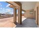 Covered patio area perfect for outdoor entertaining and relaxation, featuring sturdy support beams at 32535 N 135Th Dr, Peoria, AZ 85383
