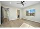 Light and airy bedroom with wood floors and ensuite bathroom access at 8742 E Woodley Way, Scottsdale, AZ 85266