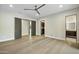 Spacious bedroom with wood floors and access to a private bathroom at 8742 E Woodley Way, Scottsdale, AZ 85266