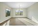 Bright dining room with hardwood floors and a modern chandelier at 8742 E Woodley Way, Scottsdale, AZ 85266