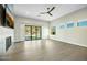 Living room with hardwood floors, fireplace, and sliding doors leading to a private backyard at 8742 E Woodley Way, Scottsdale, AZ 85266