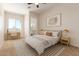 Cozy bedroom filled with light features a desk and chair, nightstands, and neutral carpet at 1606 E Minton St, Mesa, AZ 85203