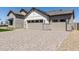 Front exterior view features a multi-car garage, stone and siding accents, and a paved driveway at 1606 E Minton St, Mesa, AZ 85203