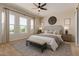 Comfortable main bedroom with lots of light, neutral walls and carpet, and a ceiling fan at 1606 E Minton St, Mesa, AZ 85203