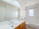 Bright bathroom with double sink vanity, large mirror, and shower over tub at 634 S Pasadena --, Mesa, AZ 85210