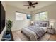 Bedroom featuring a bed, two windows, decor, and a ceiling fan at 634 S Pasadena --, Mesa, AZ 85210