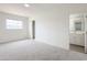 Spacious bedroom with neutral carpet, closet, and convenient access to the en-suite bathroom at 634 S Pasadena --, Mesa, AZ 85210