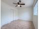 Vacant bedroom featuring tile flooring, a window, and a closet at 634 S Pasadena --, Mesa, AZ 85210