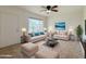 Bright living room featuring tile flooring, comfortable seating, and a large window for natural light at 634 S Pasadena --, Mesa, AZ 85210