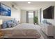 Serene main bedroom with soft blue accents, a plush bed, and ample natural light at 634 S Pasadena --, Mesa, AZ 85210
