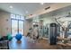 Bright gym with strength training machines, free weights and floor to ceiling mirrors for exercise and fitness at 8 E Biltmore Est # 109, Phoenix, AZ 85016