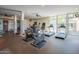 Well-equipped gym featuring treadmills, stationary bikes, and ample natural light for an invigorating workout at 8 E Biltmore Est # 109, Phoenix, AZ 85016