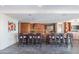 Modern kitchen with bar seating, stainless steel appliances, and sleek countertops perfect for entertaining at 8 E Biltmore Est # 109, Phoenix, AZ 85016