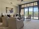 Bright and airy living room featuring large windows, comfortable seating, and stylish decor at 8 E Biltmore Est # 109, Phoenix, AZ 85016