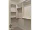 Organized walk-in closet with custom shelving and ample storage space for clothing and accessories at 8 E Biltmore Est # 109, Phoenix, AZ 85016
