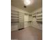 Spacious walk-in closet featuring an abundance of shelving and clothing rods at 8 E Biltmore Est # 109, Phoenix, AZ 85016