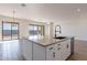 Kitchen island with modern appliances and access to backyard at 20251 W Catalina Dr, Buckeye, AZ 85396