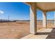Backyard view from the covered patio, showing the blank canvas available for creating your dream outdoor space at 22205 W Ocupado Dr, Wittmann, AZ 85361