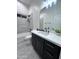 Modern bathroom with sleek vanity, shower, and matte black fixtures at 22205 W Ocupado Dr, Wittmann, AZ 85361