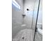 Modern bathroom featuring a stand up shower with glass door and stylish tile work at 22205 W Ocupado Dr, Wittmann, AZ 85361