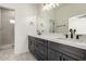 Bathroom featuring a double vanity, sleek fixtures, and walk-in shower at 22205 W Ocupado Dr, Wittmann, AZ 85361