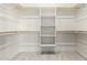 Walk-in closet with custom shelving and ample storage space at 22205 W Ocupado Dr, Wittmann, AZ 85361