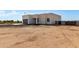 New construction single-Gathering home featuring a clean modern design and a spacious yard ready for landscaping at 22205 W Ocupado Dr, Wittmann, AZ 85361