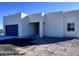 Newly built home features a gray garage door and clean lines at 22205 W Ocupado Dr, Wittmann, AZ 85361