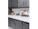Clean white kitchen countertop with decorative letters and a recipe book stand at 22205 W Ocupado Dr, Wittmann, AZ 85361