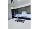 Beautiful kitchen island with a stainless steel sink and bright white countertop at 22205 W Ocupado Dr, Wittmann, AZ 85361