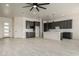 Open concept kitchen with gray cabinets, white quartz countertops and stainless steel appliances at 22205 W Ocupado Dr, Wittmann, AZ 85361