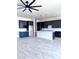 Spacious kitchen featuring dark cabinets, a center island, and an open layout at 22205 W Ocupado Dr, Wittmann, AZ 85361