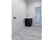 A convenient laundry room area, complete with sink, cabinet, and hookups at 22205 W Ocupado Dr, Wittmann, AZ 85361