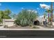 Charming single-story home with a landscaped front yard and driveway at 8044 E Del Mercurio Dr, Scottsdale, AZ 85258