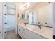 Clean bathroom with double vanity and a tub at 20252 W Catalina Dr, Buckeye, AZ 85396