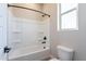 Simple bathroom with shower/tub combo and built-in shelves at 20252 W Catalina Dr, Buckeye, AZ 85396