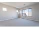 Spacious bedroom with carpet flooring and large window at 20252 W Catalina Dr, Buckeye, AZ 85396
