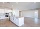 Open concept kitchen with island, stainless steel appliances, and breakfast nook at 20252 W Catalina Dr, Buckeye, AZ 85396