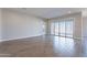 Bright and spacious living room with tile floors and sliding glass doors at 20252 W Catalina Dr, Buckeye, AZ 85396
