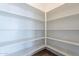 Large walk-in pantry with ample shelving for storage at 20252 W Catalina Dr, Buckeye, AZ 85396