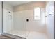 Large walk-in shower with subway tile and glass enclosure at 20252 W Catalina Dr, Buckeye, AZ 85396