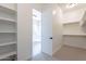 Spacious walk-in closet with ample shelving and hanging rods at 20252 W Catalina Dr, Buckeye, AZ 85396