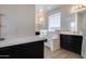 Bathroom with soaking tub and double sinks at 130 N Bay Dr, Gilbert, AZ 85233