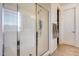 Bathroom with shower and walk-in closet at 130 N Bay Dr, Gilbert, AZ 85233