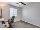 Bright bedroom with window, ceiling fan, and carpeted floor at 130 N Bay Dr, Gilbert, AZ 85233