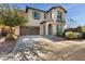 Two-story home with attached garage and front yard landscaping at 130 N Bay Dr, Gilbert, AZ 85233