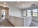 Upstairs hallway with carpet and doors to bedrooms at 130 N Bay Dr, Gilbert, AZ 85233