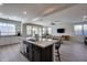 Kitchen island with granite countertop and dark cabinets at 130 N Bay Dr, Gilbert, AZ 85233