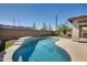 Kidney shaped pool with grassy backyard and patio at 130 N Bay Dr, Gilbert, AZ 85233